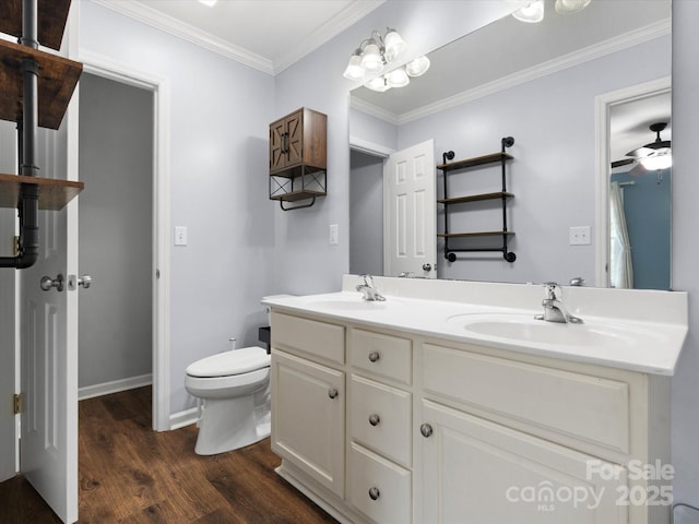 730 Cove Rd, Gastonia, NC 28052 - full bath with wood finished floors, double vanity, toilet, ornamental molding, and baseboards