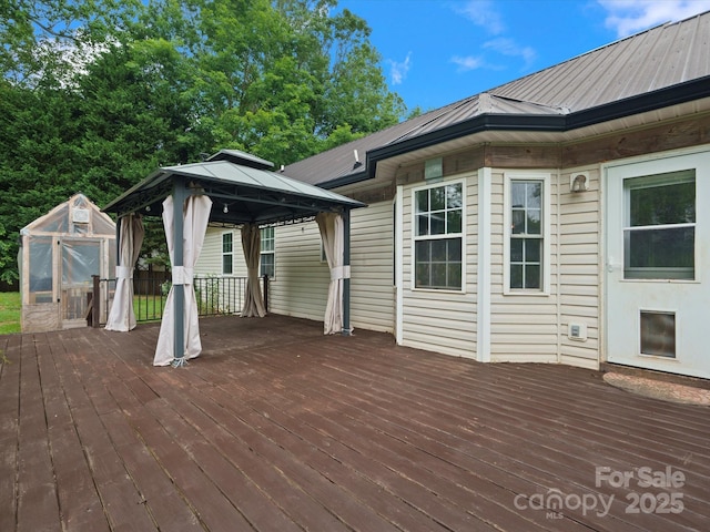 730 Cove Rd, Gastonia, NC 28052 - wooden deck featuring a gazebo, an exterior structure, and an outdoor structure