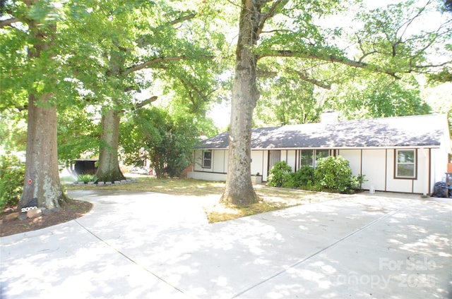 2000 Tyvola Rd, Charlotte, NC 28210 - ranch-style house with a chimney and concrete driveway
