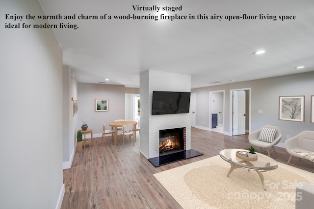 2000 Tyvola Rd, Charlotte, NC 28210 - living room with light wood finished floors, a brick fireplace, and recessed lighting