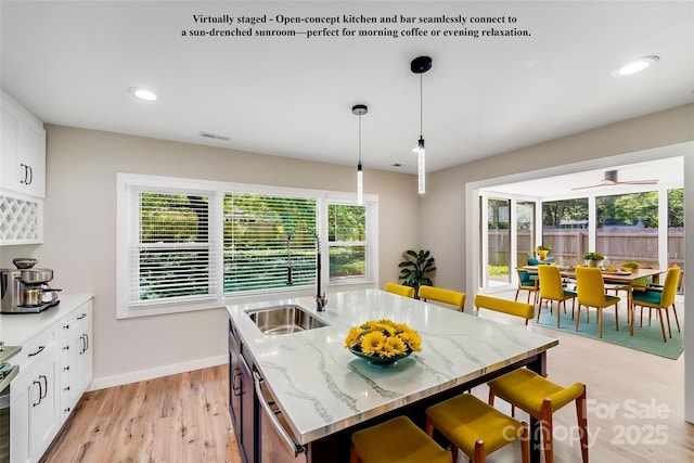 2000 Tyvola Rd, Charlotte, NC 28210 - dining space with light wood-type flooring, healthy amount of natural light, recessed lighting, and a ceiling fan