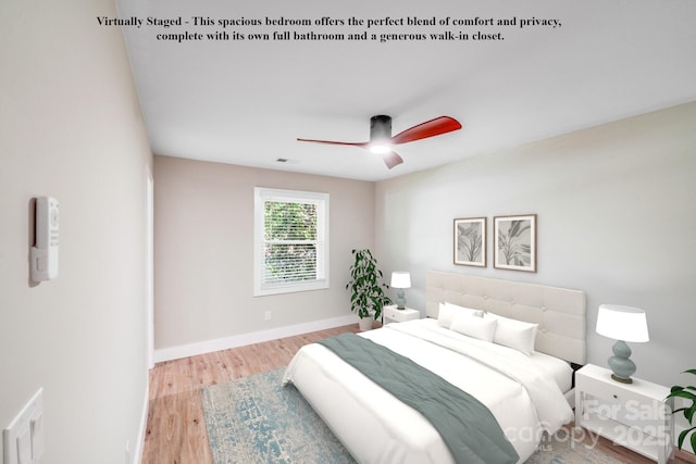 2000 Tyvola Rd, Charlotte, NC 28210 - bedroom with wood finished floors and a ceiling fan