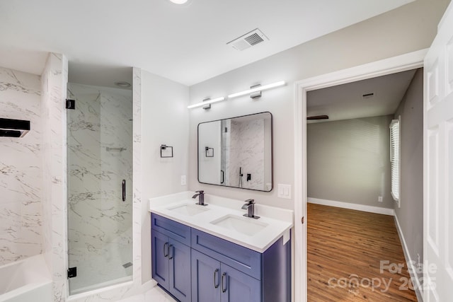 2000 Tyvola Rd, Charlotte, NC 28210 - bathroom with a marble finish shower, double vanity, and wood finished floors