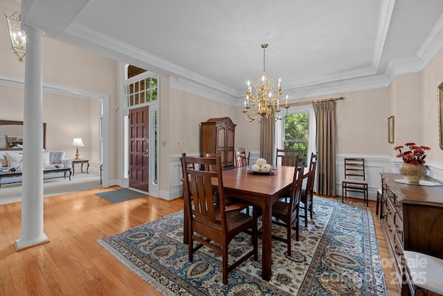 10317 Clubhouse View Ln, Mint Hill, NC 28227 - dining room featuring decorative columns, a chandelier, light wood finished floors, and ornamental molding