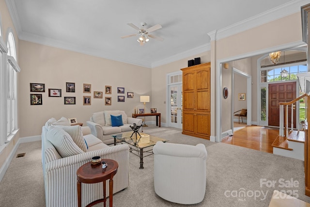 10317 Clubhouse View Ln, Mint Hill, NC 28227 - living area featuring light carpet, a chandelier, crown molding, and ceiling fan