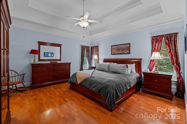 10317 Clubhouse View Ln, Mint Hill, NC 28227 - bedroom with a tray ceiling, ornamental molding, wood finished floors, and ceiling fan