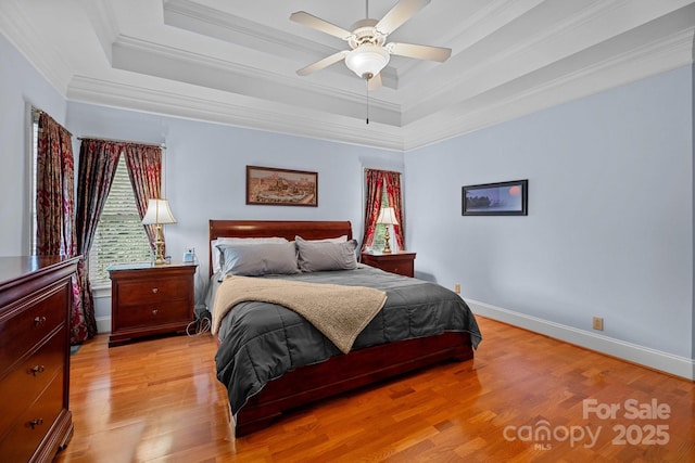 10317 Clubhouse View Ln, Mint Hill, NC 28227 - bedroom featuring ornamental molding, a raised ceiling, light wood finished floors, and ceiling fan