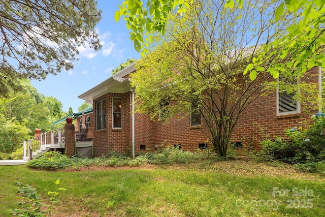 10317 Clubhouse View Ln, Mint Hill, NC 28227 - view of property exterior with crawl space, brick siding, a deck, a yard, and stairway