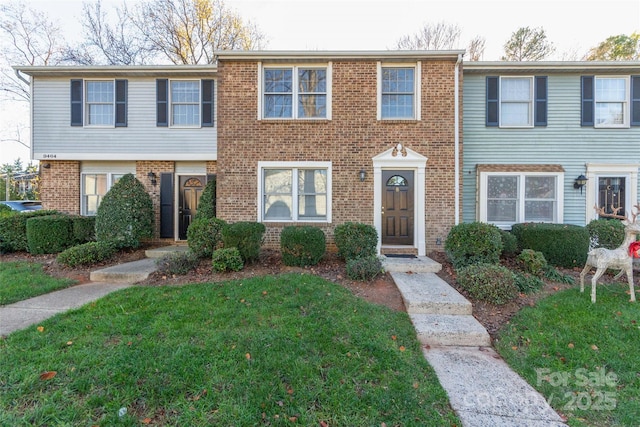 9464 Lexington Cir Unit B, Charlotte, NC 28213 - multi unit property featuring a front yard and brick siding