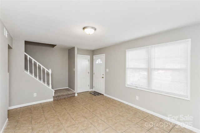 9464 Lexington Cir Unit B, Charlotte, NC 28213 - foyer with baseboards, stairway, and light tile patterned floors