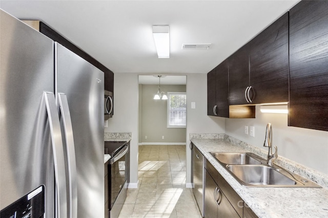 9464 Lexington Cir Unit B, Charlotte, NC 28213 - kitchen with stainless steel appliances, a sink, light countertops, and dark brown cabinetry