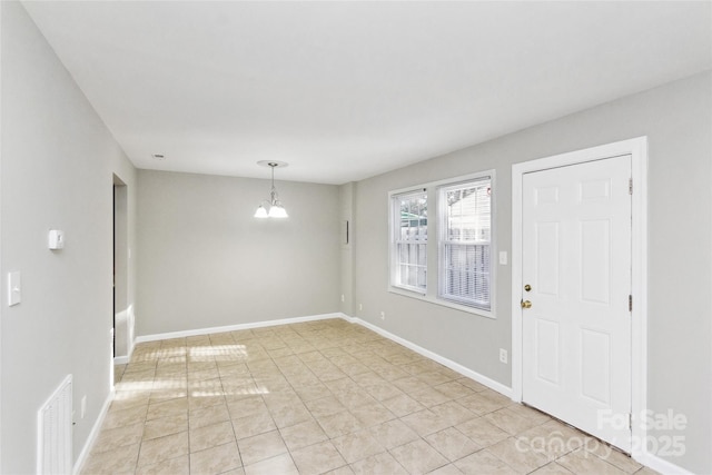 9464 Lexington Cir Unit B, Charlotte, NC 28213 - foyer featuring a chandelier, baseboards, and light tile patterned floors