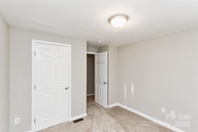 9464 Lexington Cir Unit B, Charlotte, NC 28213 - unfurnished bedroom featuring carpet and baseboards