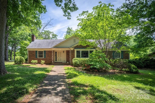 1503 Brentwood Dr, Newton, NC 28658 - single story home with a chimney, a front lawn, and french doors
