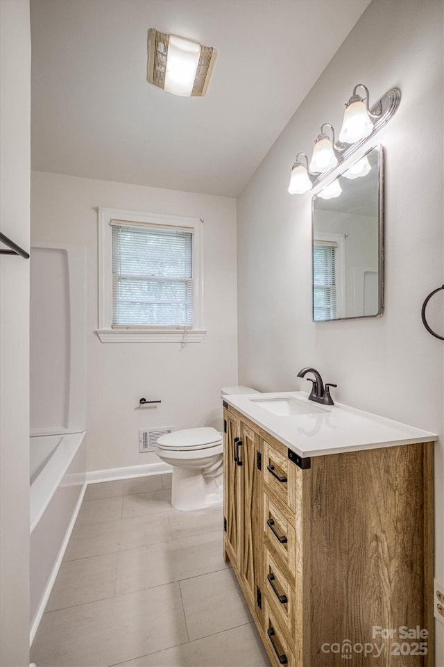 1503 Brentwood Dr, Newton, NC 28658 - full bathroom featuring vanity, toilet, a tub, and baseboards