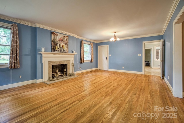 1503 Brentwood Dr, Newton, NC 28658 - unfurnished living room featuring a chandelier, plenty of natural light, wood finished floors, crown molding, and a fireplace