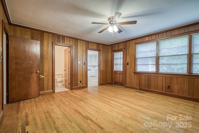 1503 Brentwood Dr, Newton, NC 28658 - empty room with light wood-style floors, ceiling fan, wooden walls, and ornamental molding