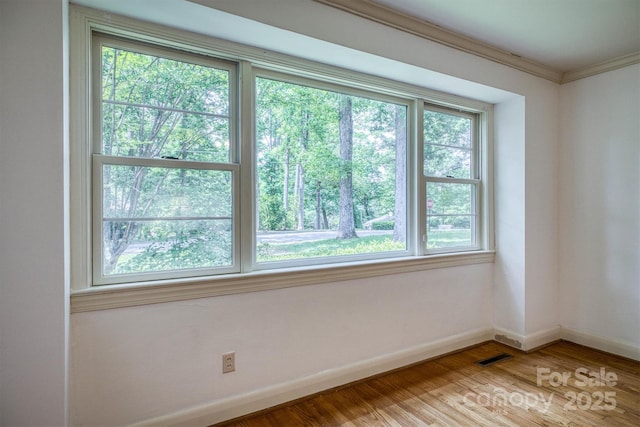 1503 Brentwood Dr, Newton, NC 28658 - spare room with baseboards, wood finished floors, and ornamental molding