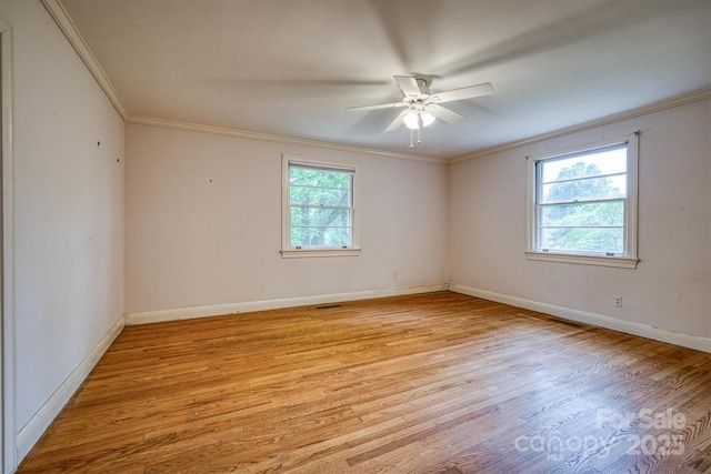 1503 Brentwood Dr, Newton, NC 28658 - spare room featuring crown molding, light wood-style floors, a ceiling fan, and baseboards