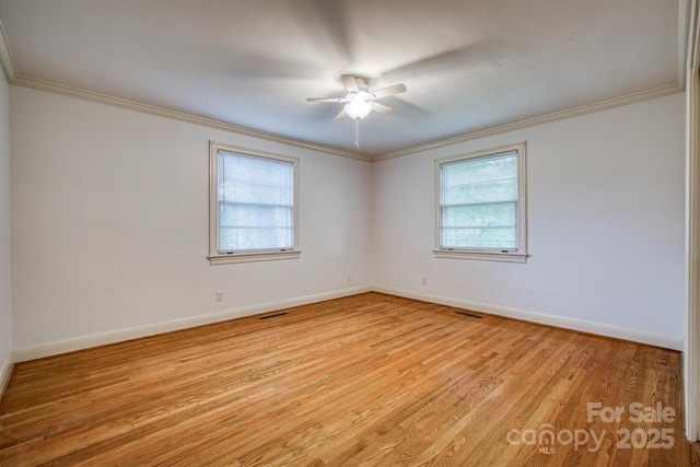 1503 Brentwood Dr, Newton, NC 28658 - empty room with healthy amount of natural light, light wood-style floors, ornamental molding, ceiling fan, and baseboards