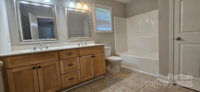 bathroom featuring tile patterned flooring, toilet, double vanity, and shower / washtub combination