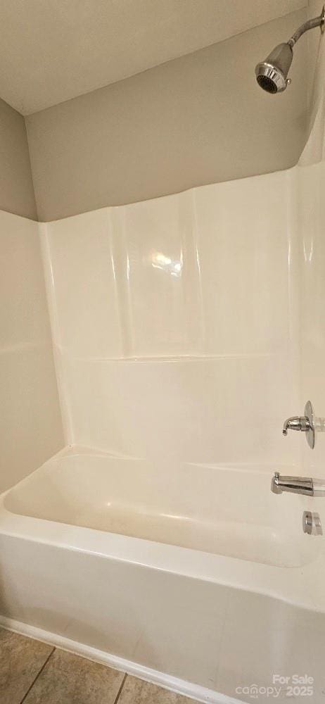 full bathroom with tile patterned flooring and shower / bathtub combination