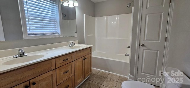 full bath with toilet, tile patterned floors, tub / shower combination, and double vanity