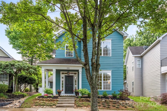 314 Center Dr, Davidson, NC 28036 - view of front of house featuring roof with shingles