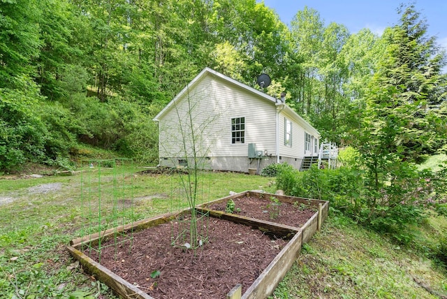370 Fox Cove Rd, Mars Hill, NC 28754 - view of side of property with a garden, crawl space, a lawn, and a wooden deck