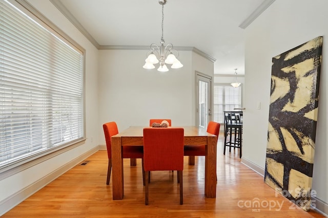 1705 Townsend Ln, Rock Hill, SC 29730 - dining room with a chandelier, light wood-style floors, baseboards, and ornamental molding