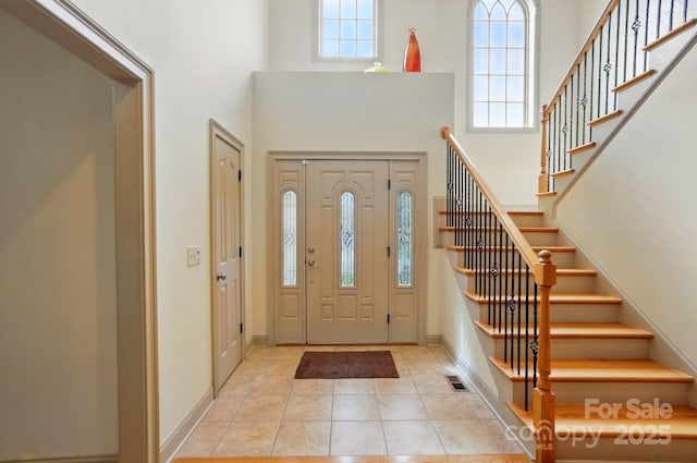 1705 Townsend Ln, Rock Hill, SC 29730 - tiled entrance foyer featuring a towering ceiling, stairway, and baseboards