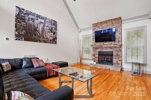1705 Townsend Ln, Rock Hill, SC 29730 - living room with vaulted ceiling, wood finished floors, plenty of natural light, and a fireplace