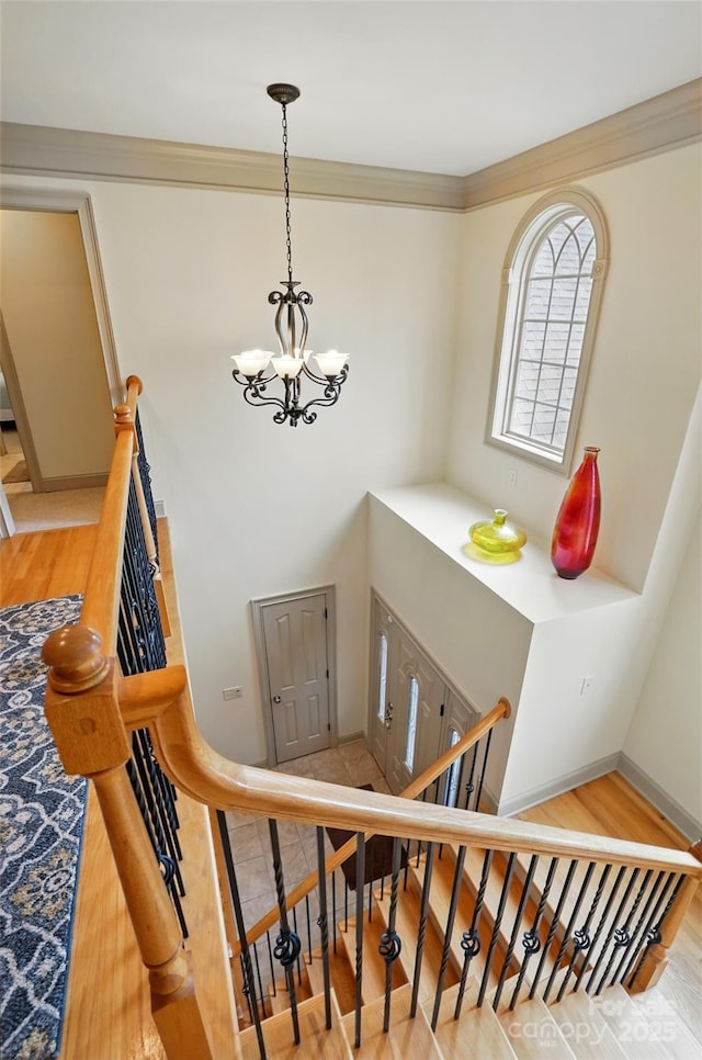 1705 Townsend Ln, Rock Hill, SC 29730 - stairs featuring a chandelier, wood finished floors, baseboards, and ornamental molding