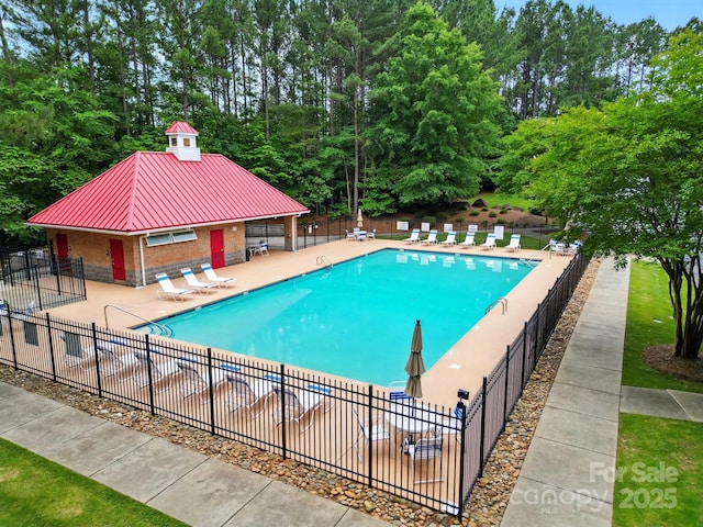 1705 Townsend Ln, Rock Hill, SC 29730 - community pool featuring a patio area and view of scattered trees