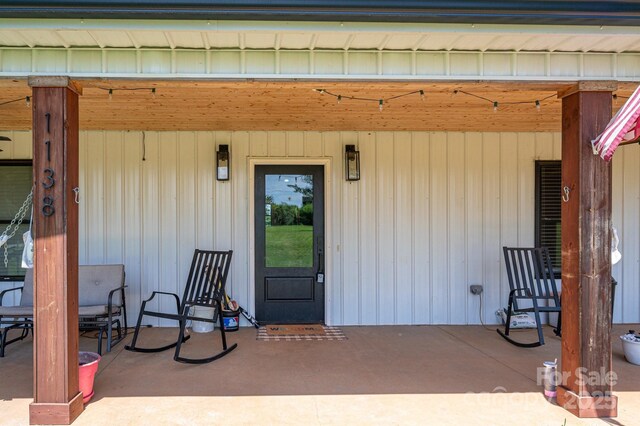 1138 Zeb Haynes Rd, Maiden, NC 28650 - entrance to property with a patio area and board and batten siding
