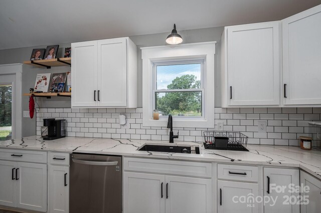 1138 Zeb Haynes Rd, Maiden, NC 28650 - kitchen with stainless steel dishwasher, open shelves, white cabinets, and tasteful backsplash