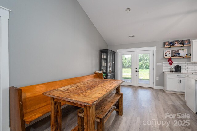 1138 Zeb Haynes Rd, Maiden, NC 28650 - dining area with lofted ceiling, light wood-style flooring, and french doors