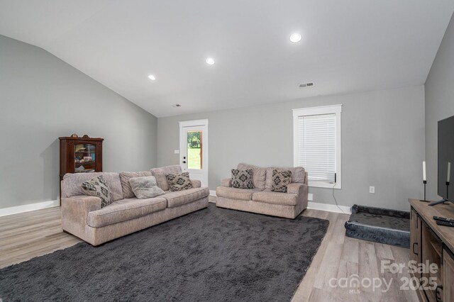1138 Zeb Haynes Rd, Maiden, NC 28650 - living room featuring light wood-type flooring, vaulted ceiling, baseboards, and recessed lighting