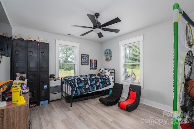 1138 Zeb Haynes Rd, Maiden, NC 28650 - bedroom with multiple windows, light wood finished floors, and baseboards