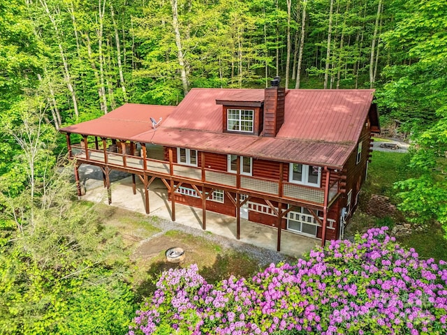 287 Sara Ridge Rd, Waynesville, NC 28786 - view of front facade featuring a patio, a chimney, metal roof, and a wooden deck