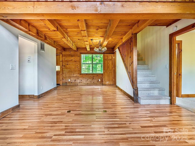 287 Sara Ridge Rd, Waynesville, NC 28786 - unfurnished living room with wooden ceiling, light wood finished floors, stairway, a chandelier, and baseboards