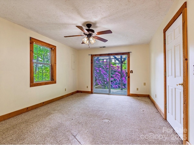 287 Sara Ridge Rd, Waynesville, NC 28786 - unfurnished room with carpet floors, healthy amount of natural light, baseboards, a ceiling fan, and a textured ceiling