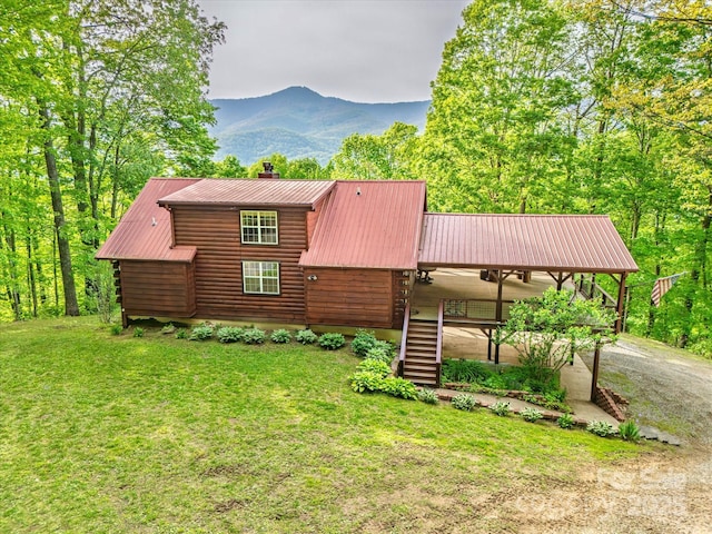 287 Sara Ridge Rd, Waynesville, NC 28786 - view of side of home with stairway, metal roof, a lawn, a chimney, and a mountain view