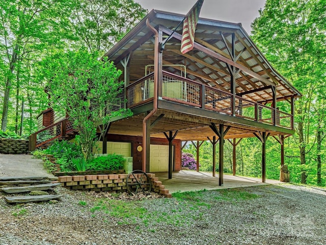 287 Sara Ridge Rd, Waynesville, NC 28786 - surrounding community with a garage, dirt driveway, and a deck