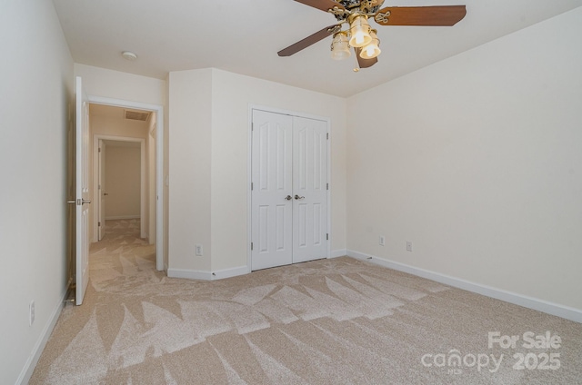 2504 Korbel Ct, Waxhaw, NC 28173 - unfurnished bedroom featuring carpet, a closet, and ceiling fan