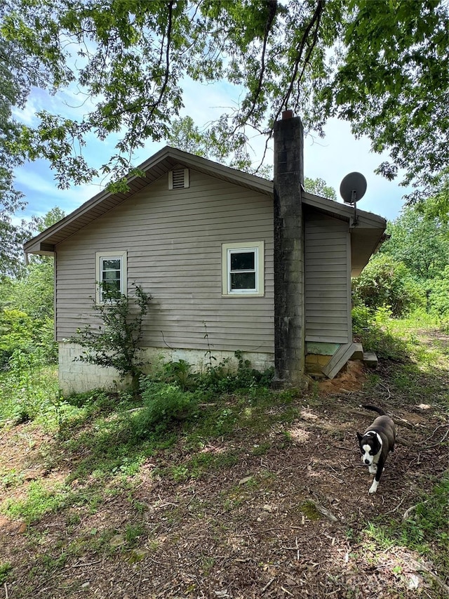 835 Mountain View Church Rd, Zirconia, NC 28790 - view of home's exterior featuring a chimney
