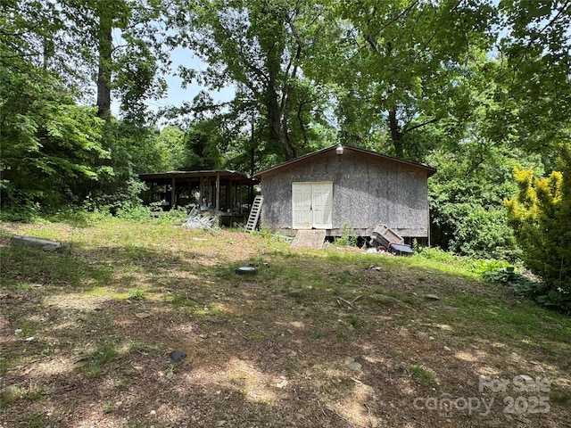 835 Mountain View Church Rd, Zirconia, NC 28790 - view of property exterior with an outbuilding and a shed
