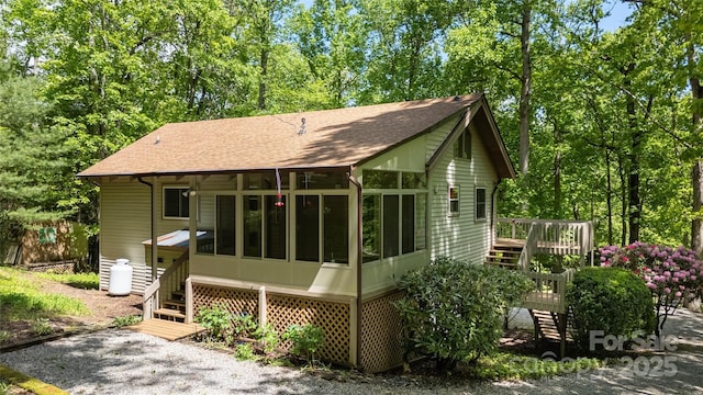 1 Spring Rd, Spruce Pine, NC 28777 - back of house with a shingled roof, a deck, stairs, and a sunroom
