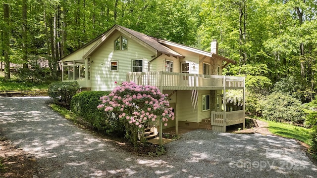 1 Spring Rd, Spruce Pine, NC 28777 - chalet / cabin with a sunroom, a chimney, a forest view, and crawl space