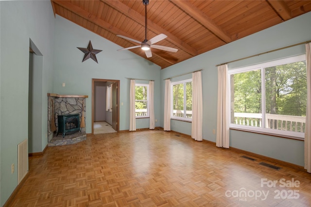 1 Spring Rd, Spruce Pine, NC 28777 - unfurnished living room featuring baseboards, wood ceiling, a ceiling fan, high vaulted ceiling, and beam ceiling